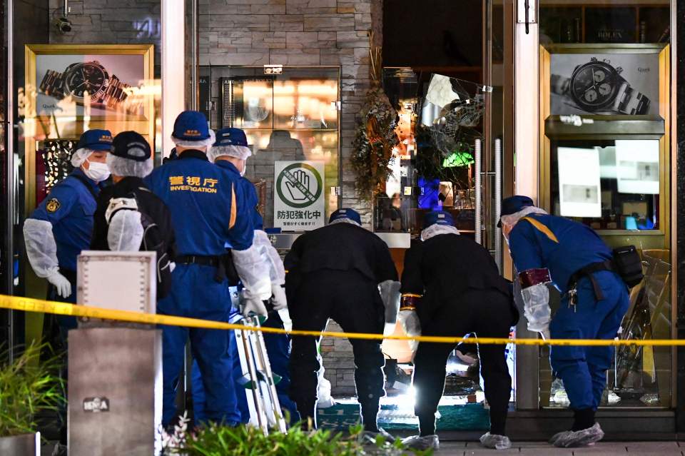 Police investigating a robbery at a watch store.