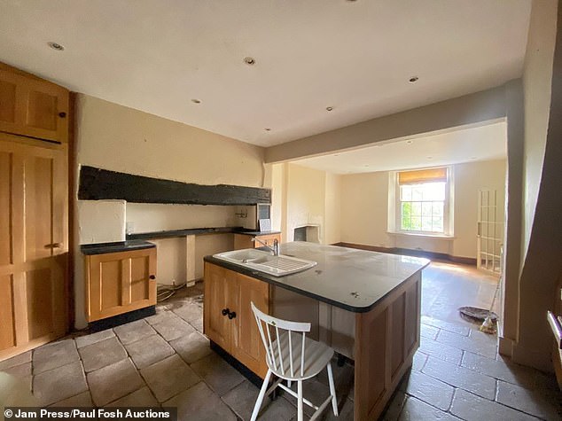 The three-storey property in rural Devon has been described as needing 'modernisation'
