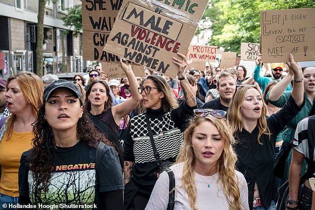 Participants in a weekly protest march against femicide in Rotterdam where the activists want to raise awareness of the problem of domestic violence