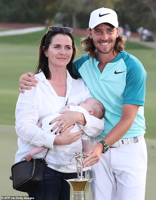 Tommy and Clare pose with baby Frankie after Tommy won the European Tour Order of Merit in 2017