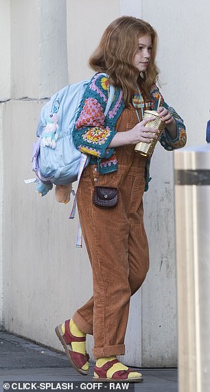 Meanwhile Ginny was dressed in orange dungarees and a colourful crochet cardigan along with clashing yellow socks and red sandals