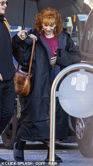 During a break in filming Katherine slipped on a dry robe and popped her feet into comfy sandals