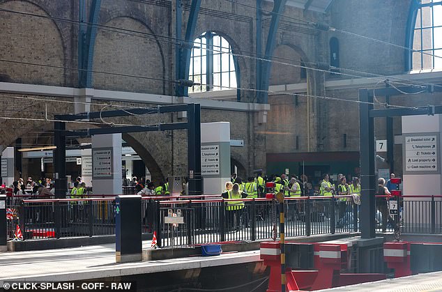 Crew took over the platform with dozens of staff in high-vis vests