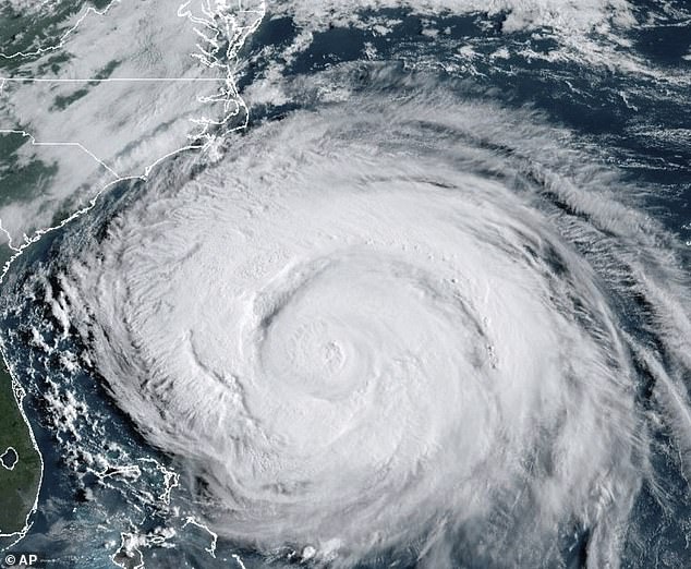 Hurricane Erin (pictured) could see 16ft waves crashing into Britain in the coming days as the huge US storm barrels across the Atlantic. The storm underwent a 'remarkable' 24-hour transition from a tropical storm to a 160mph Category 5 'monster' last weekend