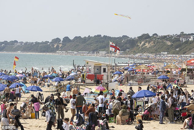 Temperatures over 28.2C would make Monday the second hottest late August Bank Holiday since it began 60 years ago. Pictured: Bournemouth Beach on Sunday