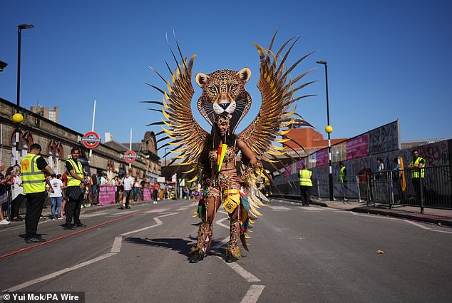 A participant ahead of the Notting Hill Carnival celebration in west London today