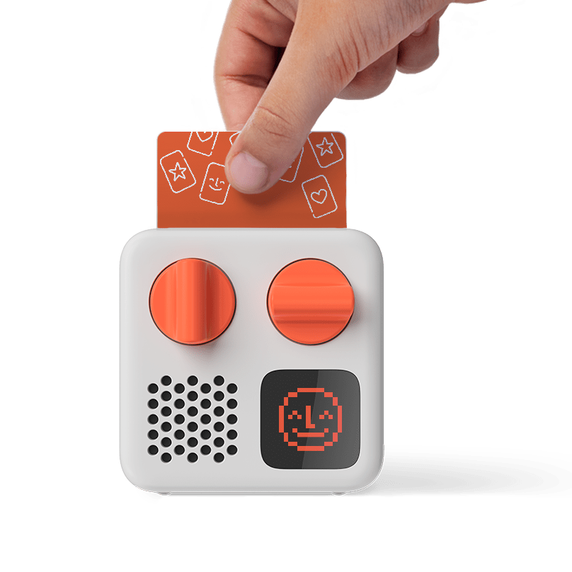 Hand inserting card into yotomini device.