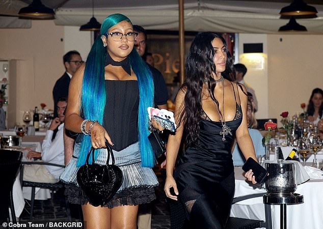 North wore silver jewellery and a pair of stylish spectacles