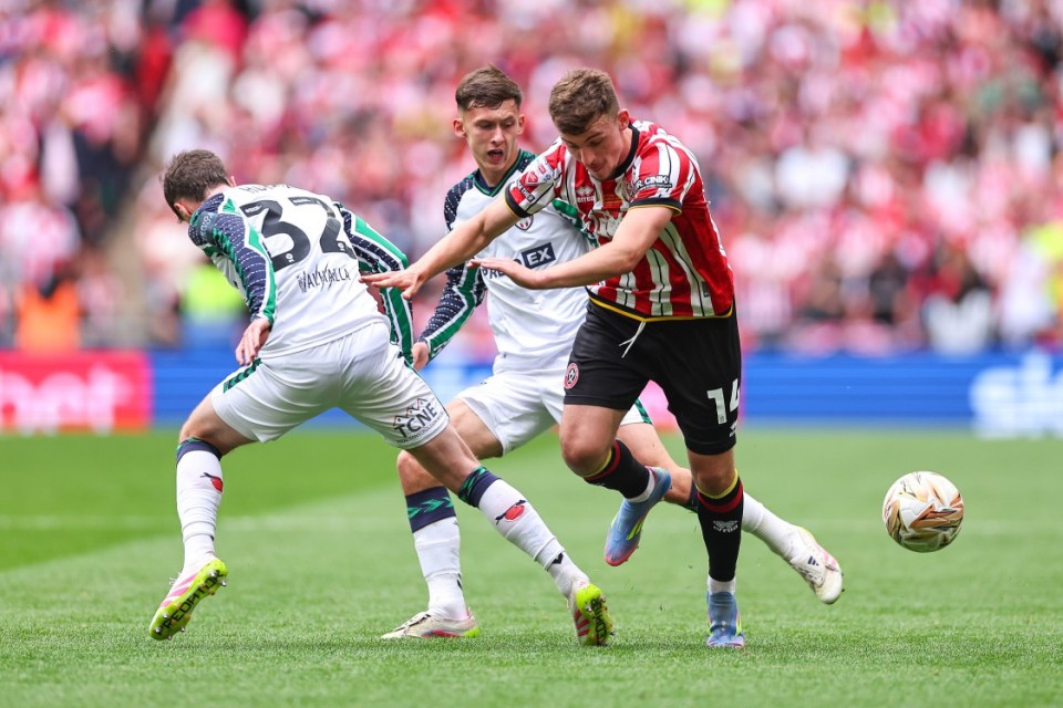 Soccer players vying for the ball during a match.