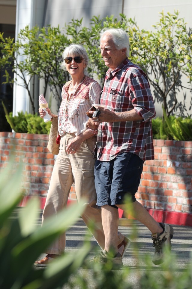 Mark Harmon and Pam Dawber walking down the street, holding hands and eating ice cream.