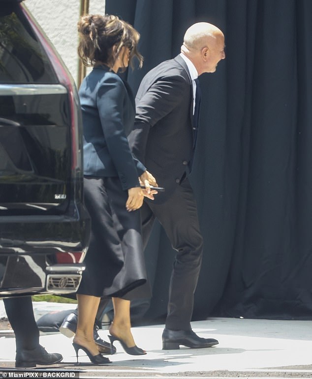 Bezos arriving at the Caballero Rivero Westchester funeral home holding hands with his new wife Lauren Sanchez