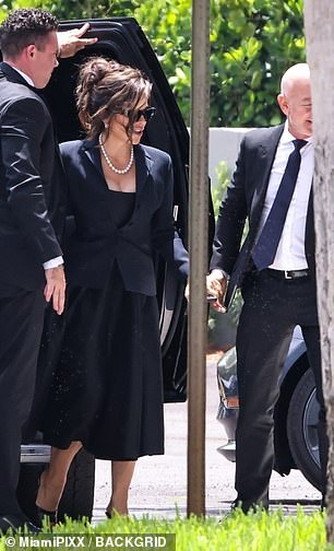 His wife Lauren Sanchez was seen following behind as they headed into the venue
