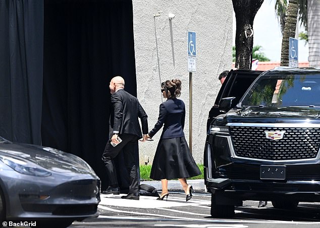 The couple were seen arriving at the funeral home hand-in-hand, both dressed in all-black attire