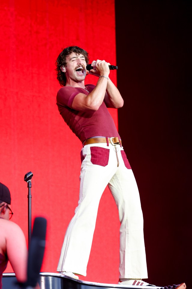Benson Boone performing on stage.