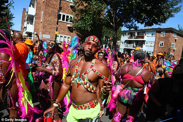 Attendees celebrate Caribbean culture wearing a myriad of flamboyant and colourful outfits