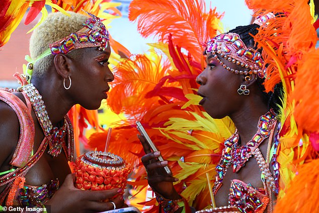 Revellers take part in the Notting Hill Carnival on August 25, 2025 in London, England