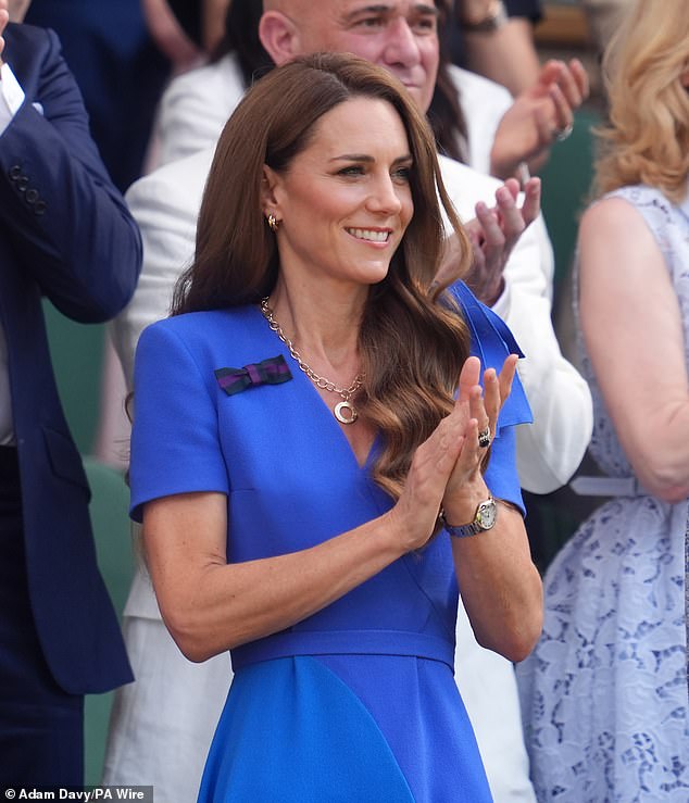 Kate's usual brunette locks are a few shades darker. Pictured at Wimbledon in July