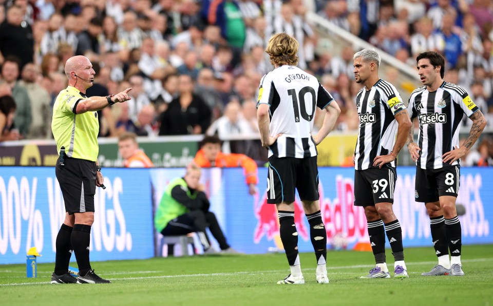 Referee sending off Newcastle player.