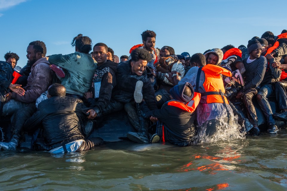 Migrants crowded in a small boat crossing the English Channel.