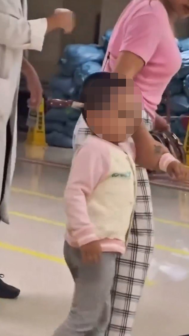 Footage taken outside the Dongchuan People’s Hospital, in south-west China, appeared to show the young child being walked around by her mother with a six-inch blade stuck just above her right ear