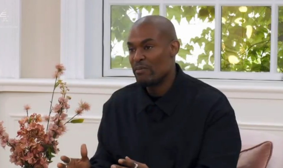 Man in black shirt speaking.