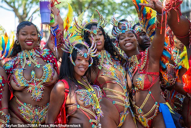 Many participants wore eccentric and flamboyant outfits as thousands of revellers lined the streets