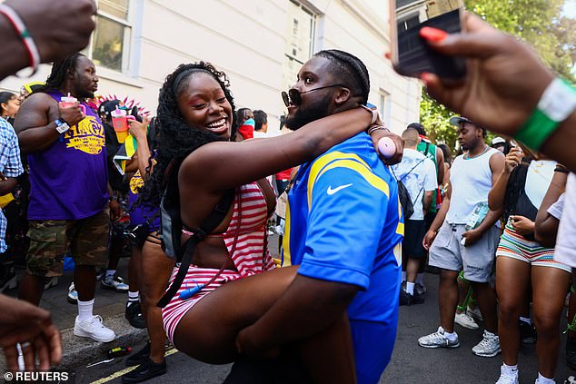 Young people danced in the streets to celebrate the annual carnival which sees west London transformed into a sea of bright colours and music