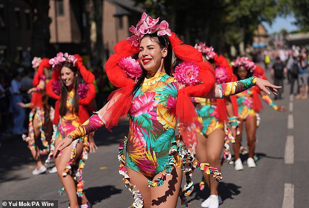 Thousands of people lined the route in sunny weather, with temperatures soaring to 26C