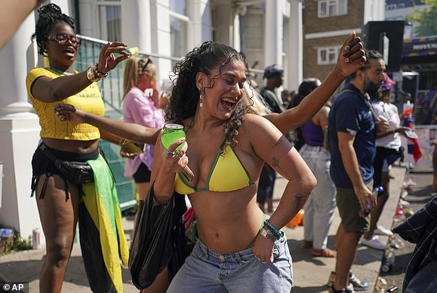Many flamboyant outfits were on display as the west London celebration continued into its second night