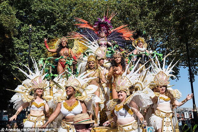 Revellers of Notting Hill Carnival paraded the streets in glamorous and eccentric outfits alongside colourful floats to celebrate the annual Caribbean festival