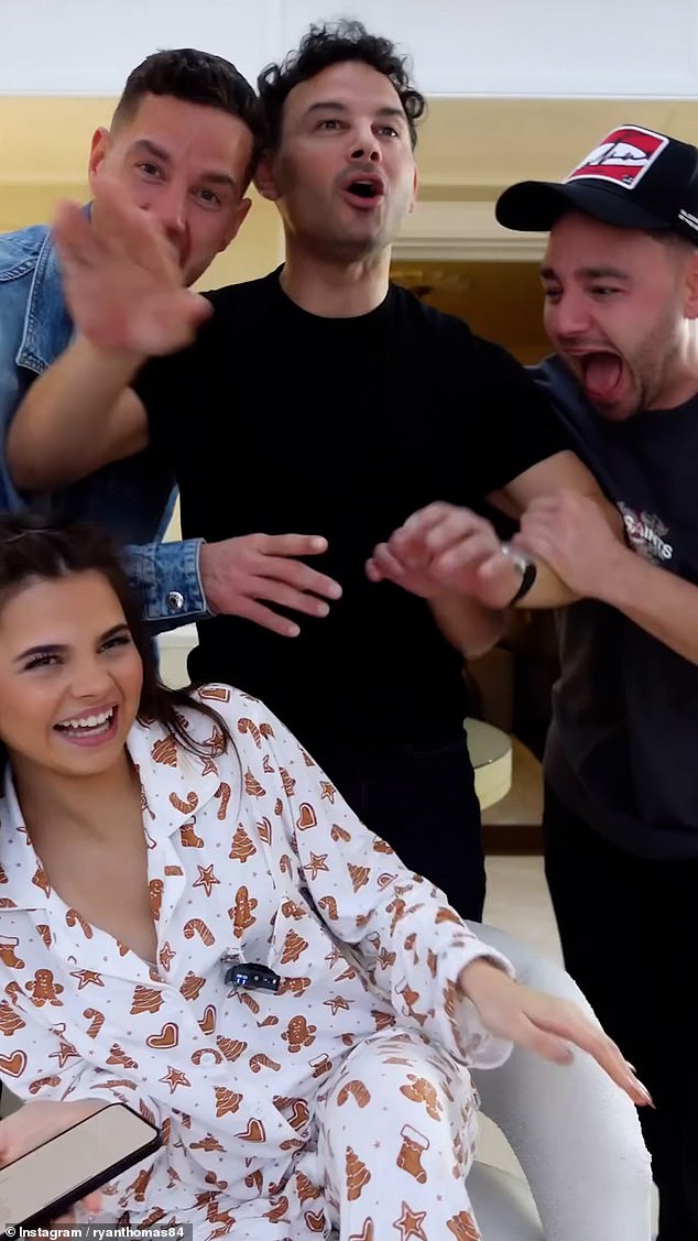 Scarlett Thomas is pictured with father Ryan and his brothers, Adam and Scott