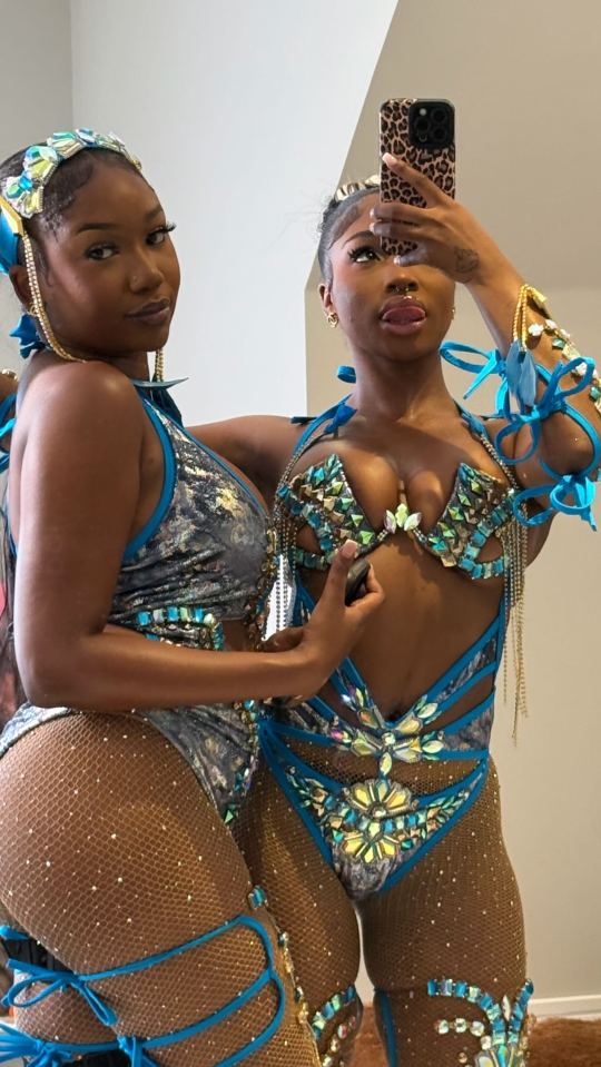 Two women in jeweled carnival costumes.