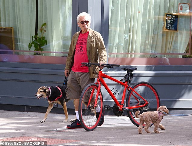 The star multi-tasked with his bicycle, dog, and Airpods