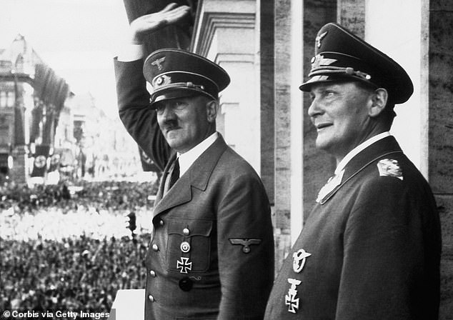 Storm Trooper commander Reichstag president Goering is pictured standing next to Adolph Hitler
