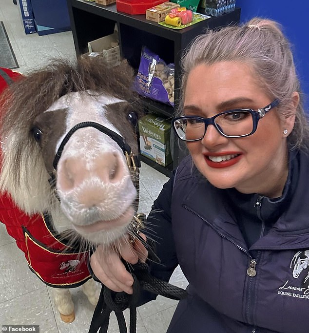 Cherene posing with one of her horses - she believes horses can help heal people in a way no other animal can