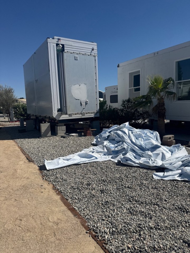 Paradise Tiny Home Community in Desert Hot Springs, California. A tiny home village in Desert Hot Springs, California, is expanding its affordable housing options with the introduction of seven new "Boxabl" homes. At Paradise Tiny Home Community, these innovative 361-square-foot studio units feature 10-foot ceilings, full-size appliances, and spacious bathrooms designed to maximize comfort in a minimal footprint.Established in November 2024 after six years of planning, Paradise represents the vision of founder TJ Modi, who immigrated to America with just $100 and built this development from the ground up. The community currently offers 90 lots in its first phase, with plans for expansion once it reaches 70-80% capacity. Photo released 26/08/2025
