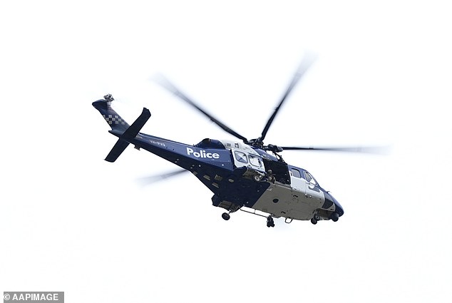 The Victoria Police Air Wing arrives in Porepunkah
