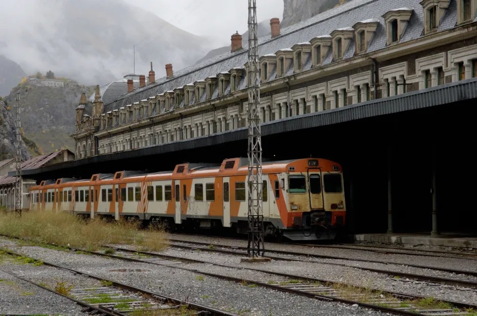 Regional train at a derelict station.