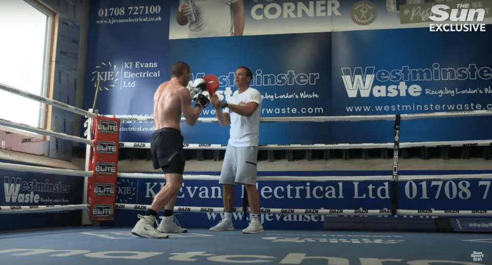 Boxer training in a boxing ring.