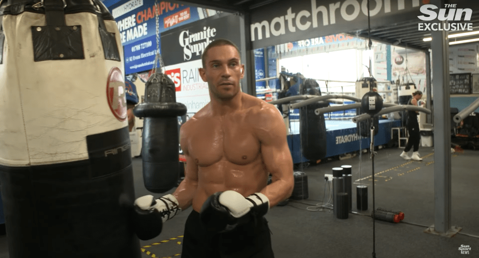 Boxer training in gym.