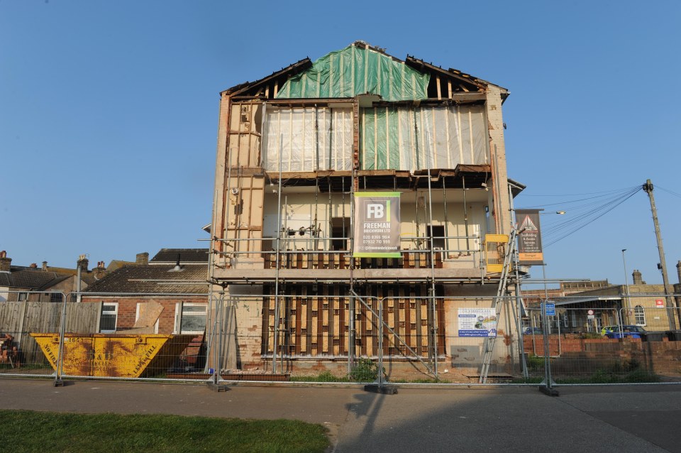 House undergoing demolition.
