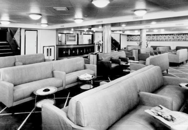 Black and white photo of the TSS Duke of Lancaster's lounge.