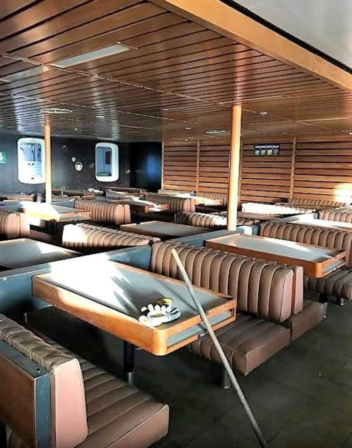 Interior of the TSS Duke of Lancaster showing a decaying dining area.