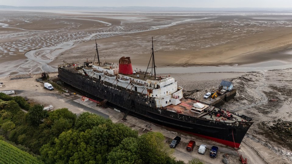 Aerial view of the beached Duke of Lancaster ferry in Llanerch-y-Mor, Wales.