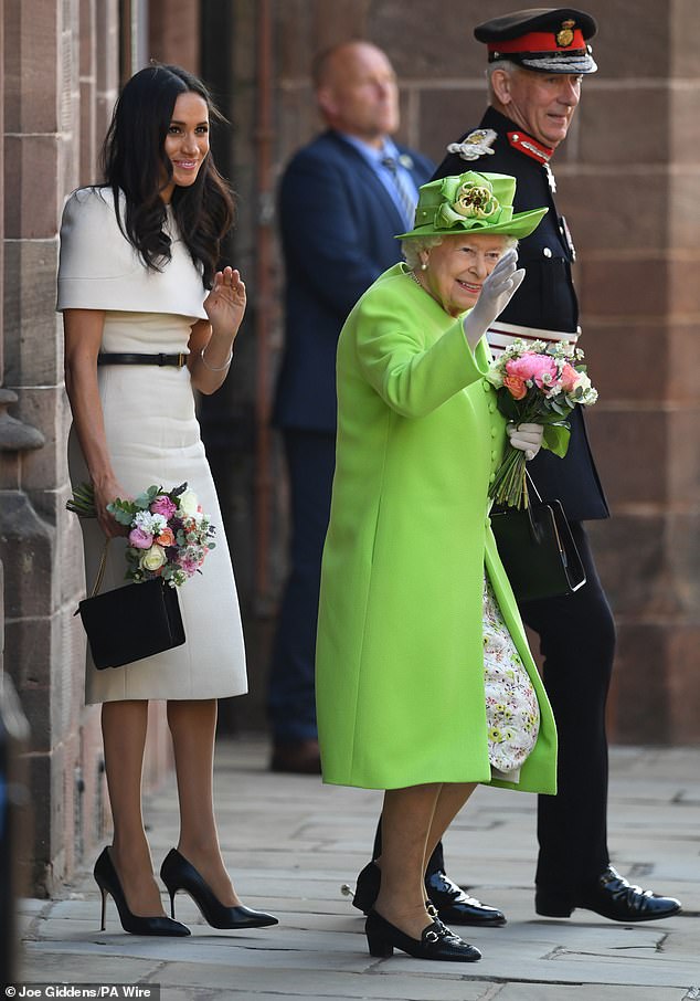 Queen Elizabeth II accompanied by the Duchess of Sussex leaving Chester Town Hall, Chester, following a lunch as guests of Cheshire West and Chester Council