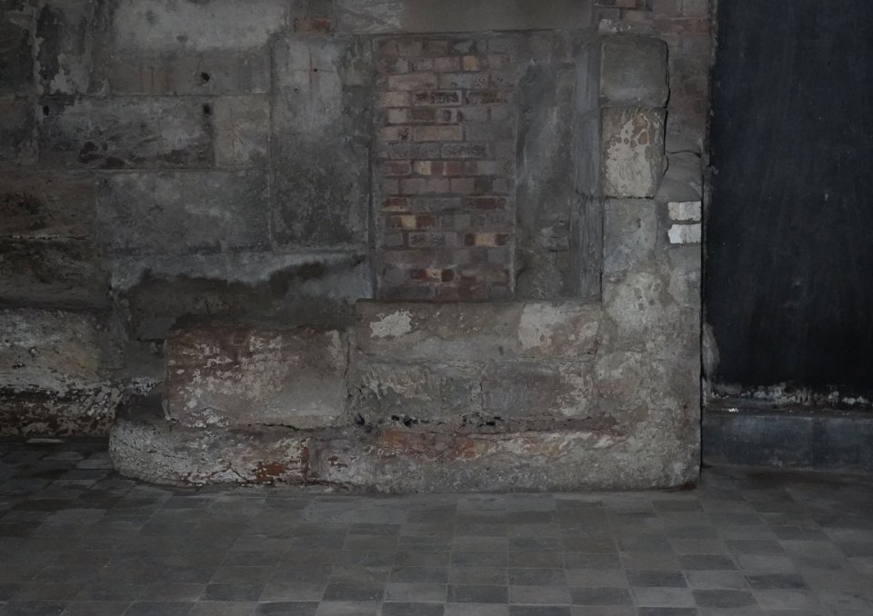 Stone structure in a dark room.