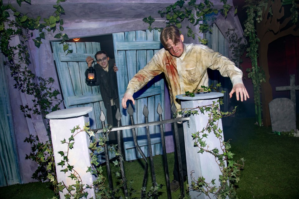 Two costumed figures at a Halloween event.