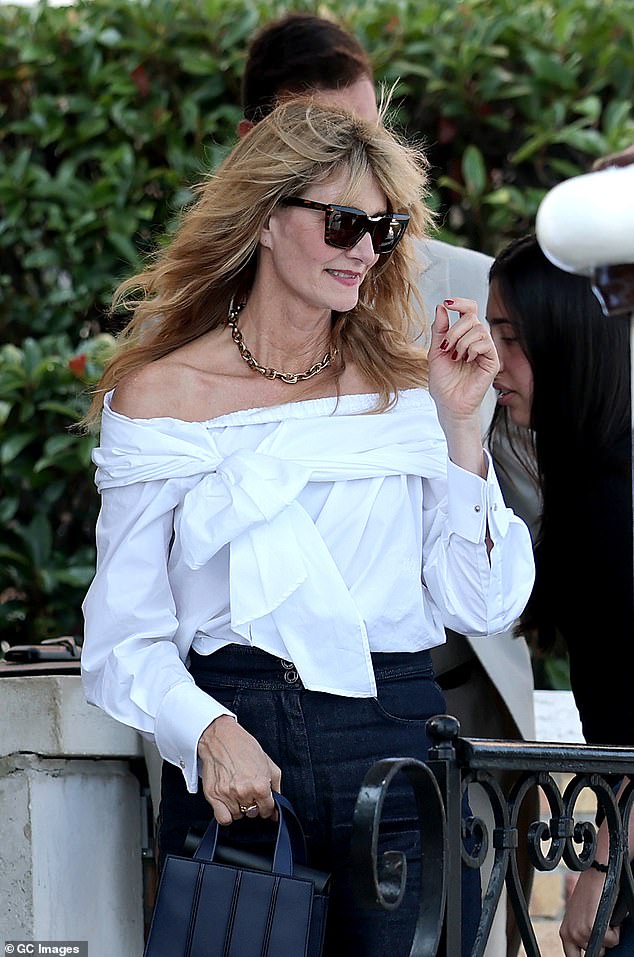 Laura added a chunky gold necklace to her ensemble