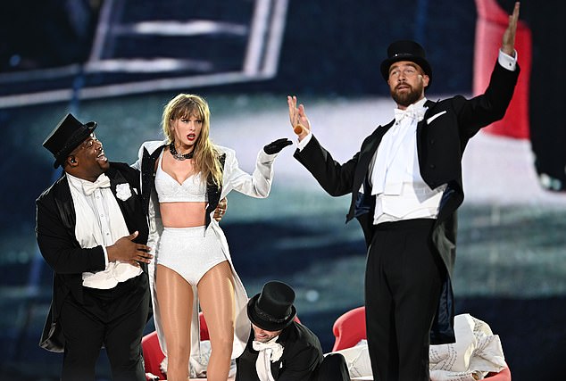 LONDON, ENGLAND - JUNE 23: (EDITORIAL USE ONLY. NO STANDALONE PUBLICATION USE (NO SPECIAL INTEREST OR SINGLE ARTIST PUBLICATION USE; NO BOOK USE)) EXCLUSIVE ACCESS. Taylor Swift is joined on stage by Travis Kelce (R), during "Taylor Swift | The Eras Tour" at Wembley Stadium on June 23, 2024 in London, England. (Photo by Gareth Cattermole/TAS24/Getty Images for TAS Rights Management )