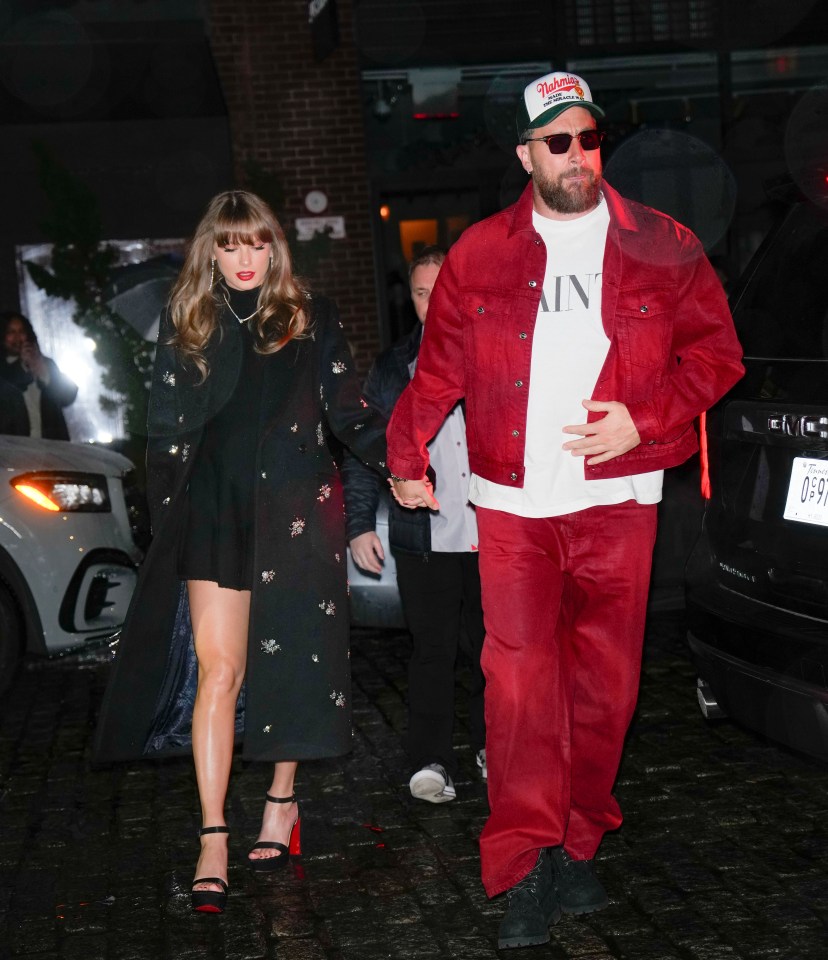 Taylor Swift and Travis Kelce walking hand-in-hand.